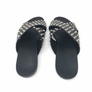 Gucci Vacchetta Austin slides in black leather crisscross design with silver studs.